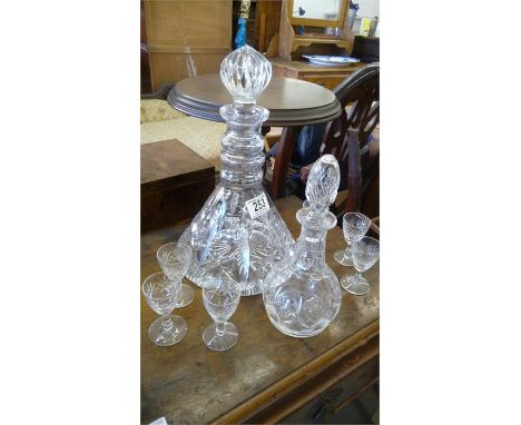 A cut glass Edinburgh crystal liqueur set and small decanter, along with a cut glass ships decanter