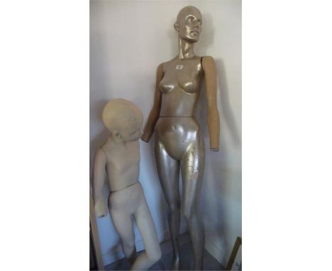A female mannequin along with a child mannequin