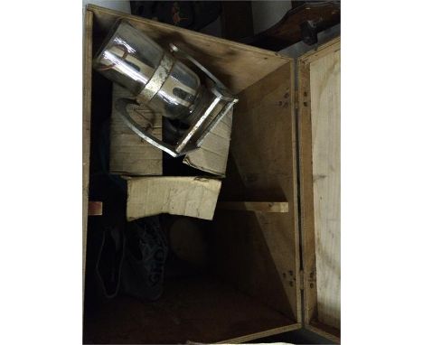 Trunk containing various items, including a butter churn, oil lamp, clogs etc.