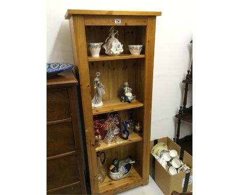 A freestanding pine shelf unit 