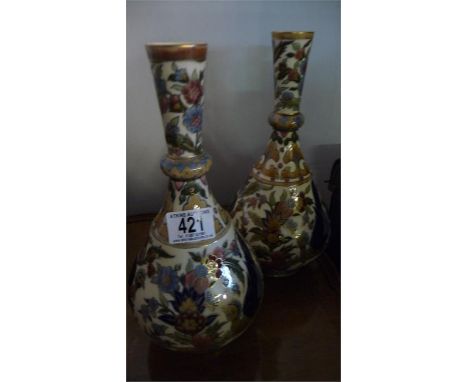 A near pair of Zsolnay baluster vases decorated with exotic birds, 28 & 29 cm approx- very slight crazing to both