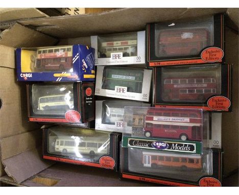 A collection of boxed buses including Corgi