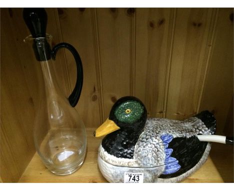 A tureen and ladle in the form of a Mallard duck (A/F) along with a decanter with blue glass handle and stopper