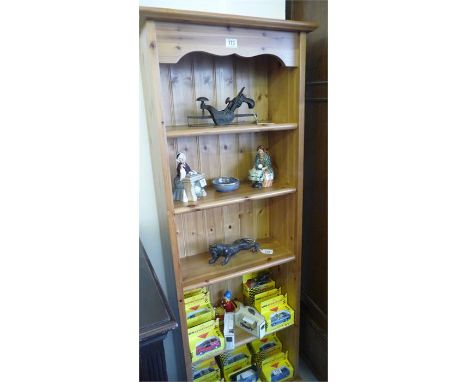 A freestanding pine shelf unit 