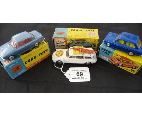 A boxed Corgi Citroen Safari (475) Olympic Winter Sports in white with yellow roof rack and 3 red skis, A boxed Corgi Rover 2