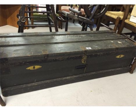 A large metal bound military trunk