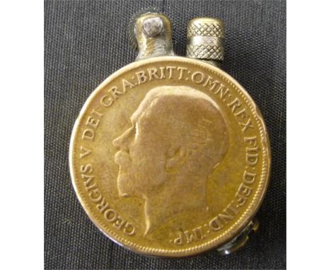 A trench art lighter made from two 1913 pennies, inscribed on edge "F Aspey, Golf Club"