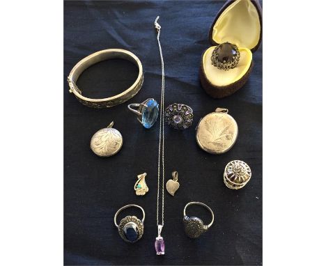 A hallmarked silver bangle along with a collection of various rings, lockets etc. all silver