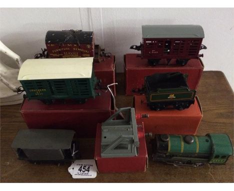 A Chad Valley 0 gauge loco 3402 and car, along with boxed Hornby vans etc- Tender no.51, Milk traffic Van no.1 ( X2), Flat tr