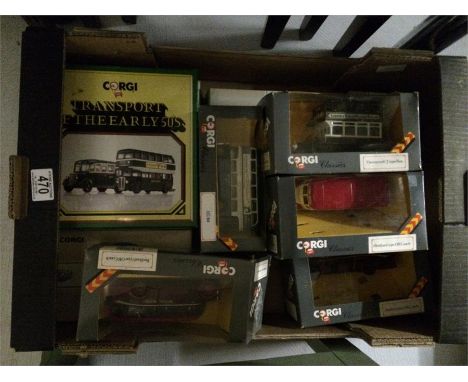 A collection of boxed Corgi buses etc.