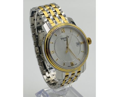 A Tissot quartz gents wrist watch, in box. Estimate £30-50.