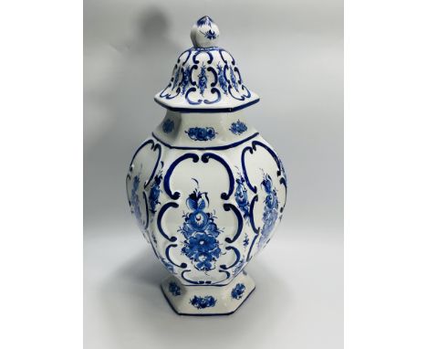 A large decorative Delft style ceramic jar and cover, signed to the base, 27cms wide x 51cms high. Estimate £20-40.