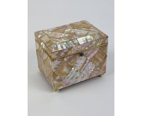 A good Victorian mother of pearl rectangular tea caddy, with original interior lid and raised upon small ball feet. 10cms wid
