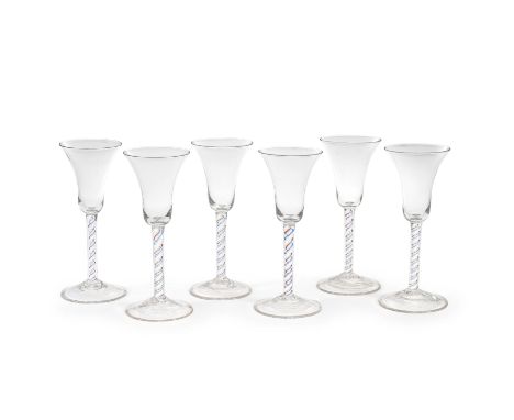 A remarkable set of six colour twist wine glasses, circa 1765With bell bowls, the stems each containing an opaque white spira