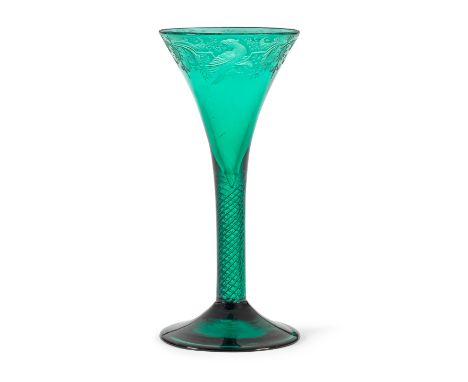 A fine and rare engraved emerald-green tinted airtwist wine glass, circa 1745-50In deep green glass, the drawn trumpet bowl f