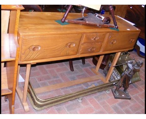 An Ercol 'Golden Dawn' vintage sideboard with two small and two large drawers - width 135cm 