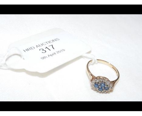 A 9ct gold diamond and sapphire ring - Size L 