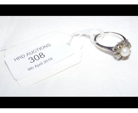A 585 marked pearl and diamond ring 