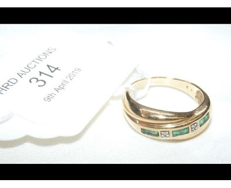 A 9ct gold emerald and diamond ring - Size P