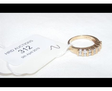 A yellow metal diamond ring - Size N 