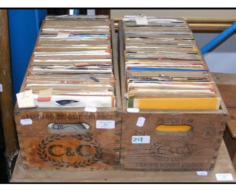 Two vintage bottle crates containing 45 rpm records, mostly 1970's 