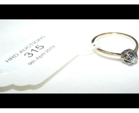 A diamond Solitaire ring in yellow metal surround - Size M