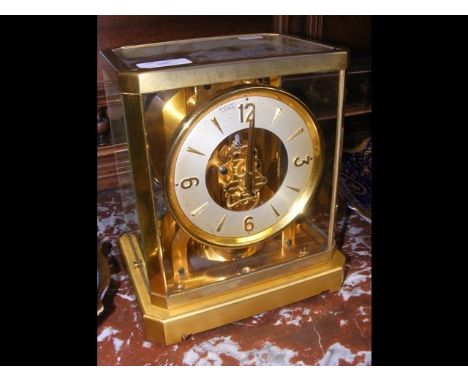A Jaeger LeCoultre Atmos Clock with skeleton movement and serial number 24539 in glazed case - 24cm high 