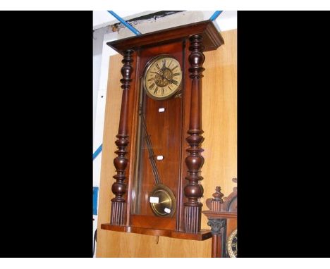 A Vienna style walnut cased wall clock with two train movement and grid pendulum - height 80cm 