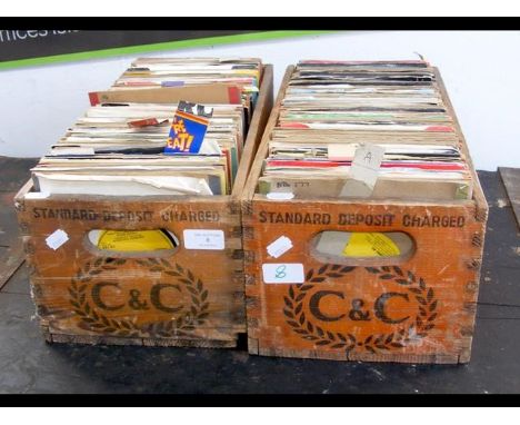 Two vintage bottle crates, containing 45 rpm records - mainly 1970's 
