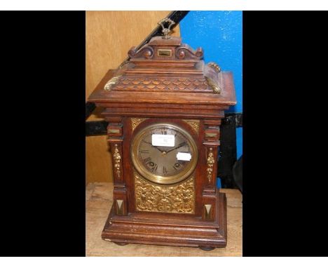 An oak cased mantel clock with two train Lenzkirch movement - height 42cm CONDITION REPORTno wood wormcorners have a little l