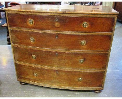 A LATE GEORGIAN MAHOGANY BOW FRONT CHEST of four long graduated drawers with brass ring handles and on four bun feet, 109cm w