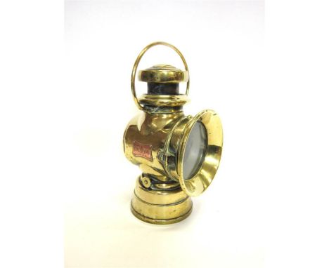 A LUCAS 'KING OF THE ROAD' OIL SIDE LAMP of polished brass, with an applied copper manufacturer's plaque stamped 'No. 724', 3