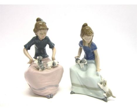 TWO LLADRO NAO FIGURES Both of girls seated playing with a pair of small dogs 17.5cm high