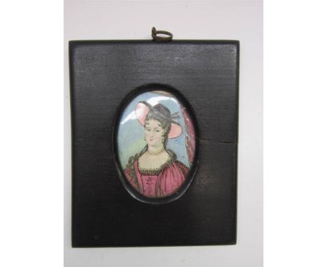 A PORTRAIT MINIATURE OF A YOUNG LADY probably late 18th century, enamel on tin, 8cm x 6cm (oval).