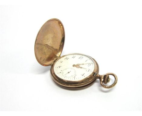 A GILT METAL HUNTER POCKETWATCH  the white enamel dial with black Arabic numerals sunken subsidiary seconds dial, gilt hands,