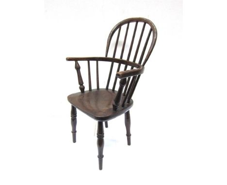 A CHILDS STICK BACK WINDSOR ARMCHAIR with dished elm seat