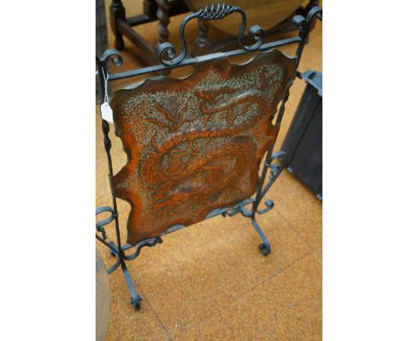 Copper fire screen depicting a dragon 