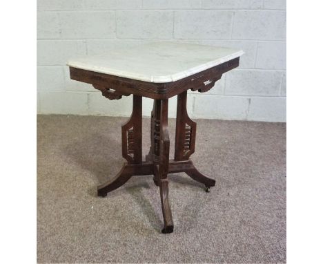 A Victorian Anglo Indian console table, late 19th century, with a shaped white marble top, on a base with four moulded and fr