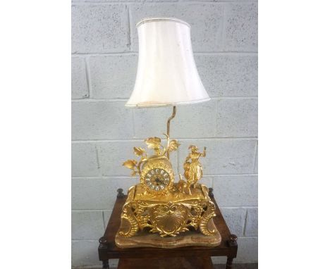 A French style gilt metal table clock and lamp stand, in Louis XV style, circa 1960, 55cm high (to socket)