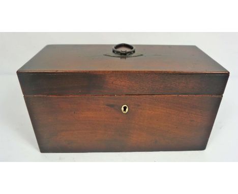 A George III mahogany tea caddy, with two internal lidded cannisters and a well for a mixing bowl (lacking bowl), 31cm wide
