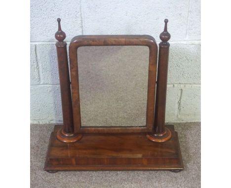 A Victorian mahogany dressing table swing mirror, with plain turned supports and a platform base, 67cm high, 61cm wide, and a