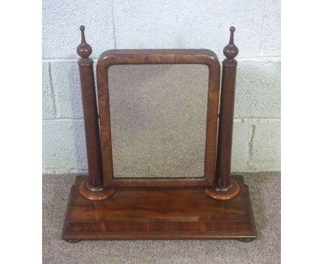 A Victorian mahogany dressing table swing mirror, with plain turned supports and a platform base, 67cm high, 61cm wide, and a