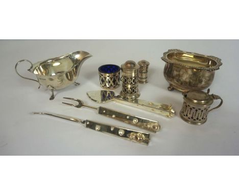 A small group of silver, including a Mappin &amp; Webb sauceboat, 15cm wide; Four silver condiments , including a fretwork de