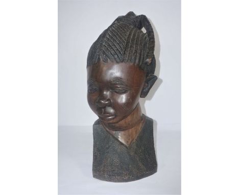 A large African hardwood portrait bust of an 'African Princess', 62cm high, bought by the vendor in the late 1980's whilst tr