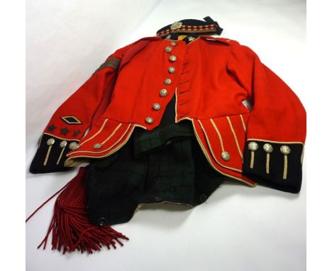 A Sergeant's dress uniform of the King's Own Scottish Borderers, including a red tunic, sash, trews, cap and badges; also a d