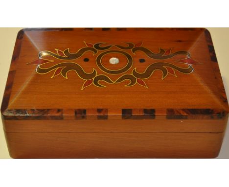 A rectangular brass and mother of pearl inlaid hardwood box