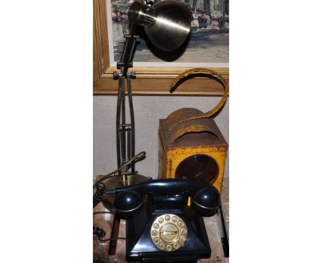 A British Telecom reproduction pyramid type telephone, in a dark green finish, together with  a 1970's roadworks oil lamp and