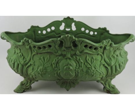 An Art Nouveau style cast iron planter, of bellied navette form, cast with flowers, raised on hoof feet and painted green, W.