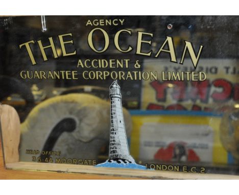 A 20th century mirrored advertising plaque for 'The Ocean Accident & Guarantee Corporation Ltd', 30 x 46cm.