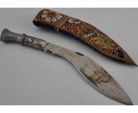 A kirpan dagger, with an embroidered scabbard